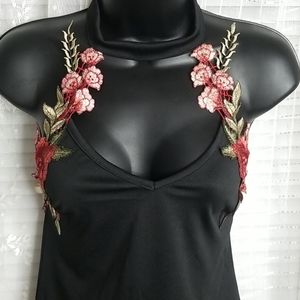 Black Floral Halter One Piece Body Suit Sz L fits more like a medium